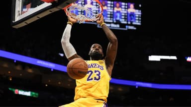 Los Angeles Lakers forward LeBron James (23) dunks against the Miami Heat during the first half at Kaseya Center.
