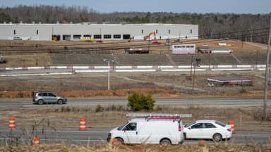 Cars drive along State Highway 123 by the former Greenville-Pickens Speedway and the construction of the Speedway Industrial Park in the city of Easley in Pickens County, SC in February 2026.