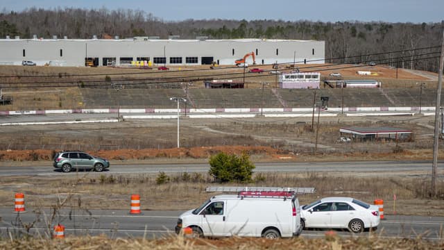 Cars drive along State Highway 123 by the former Greenville-Pickens Speedway and the construction of the Speedway Industrial Park in the city of Easley in Pickens County, SC in February 2026.