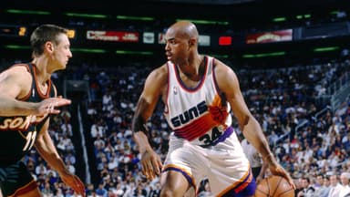 Unknown date 1996; Phoenix, AZ, USA; FILE PHOTO; Phoenix Suns forward Charles Barkley (34) is defended by Seattle Supersonics forward Detlef Schrempf (11) at America West Arena. Mandatory Credit: Imagn Images