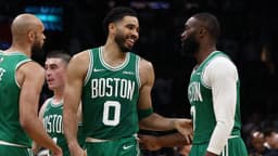 Boston Celtics forward Jayson Tatum (0) has a laugh with guard Jaylen Brown (7) during the second half against the Dallas Mavericks at TD Garden.
