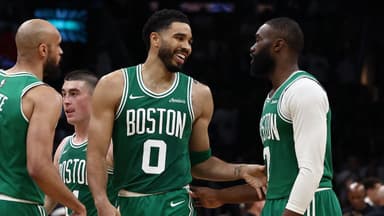 Boston Celtics forward Jayson Tatum (0) has a laugh with guard Jaylen Brown (7) during the second half against the Dallas Mavericks at TD Garden.