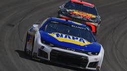 Mar 15, 2026; Las Vegas, Nevada, USA; Hendrick Motorsports driver Chase Elliott (9) leads Joe Gibbs Racing driver Chase Briscoe (19) during the Pennzoil 400 at Las Vegas Motor Speedway