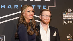 Nov 22, 2024; Charlotte, NC, USA; NASCAR Cup Series driver Tyler Reddick (45) and his wife Alexa during the NASCAR Awards Banquet at Charlotte Convention Center. Mandatory Credit: Jim Dedmon-Imagn Images
