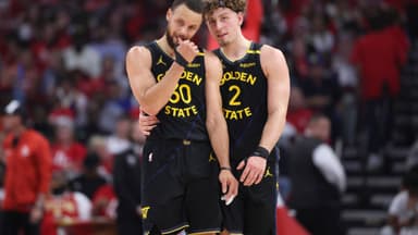 May 4, 2025; Houston, Texas, USA; Golden State Warriors guard Stephen Curry (30) and guard Brandin Podziemski (2) talk during a timeout during game seven of first round for the 2025 NBA Playoffs against the Houston Rockets at Toyota Center
