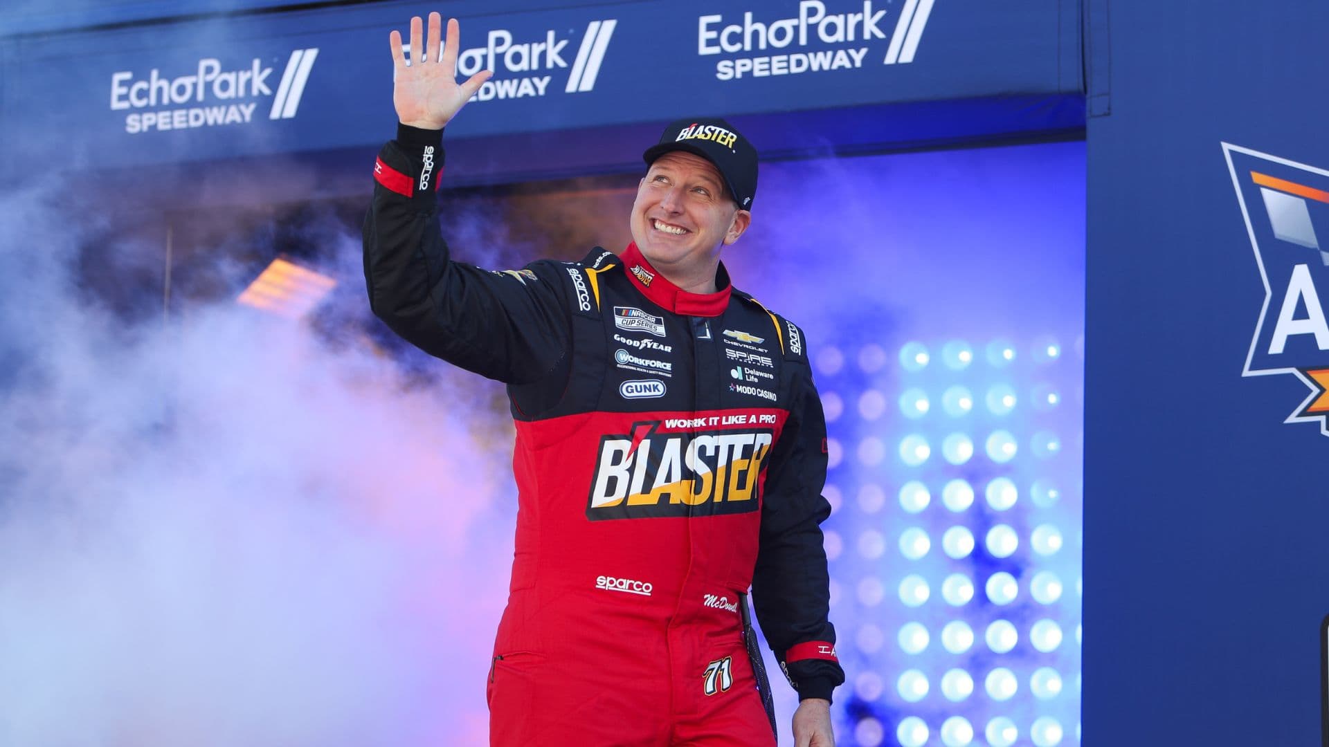 Feb 22, 2026; Hampton, Georgia, USA; NASCAR Cup Series driver Michael McDowell waves during introductions at EchoPark Speedway.