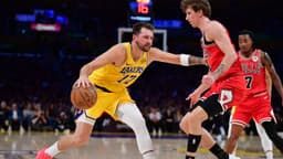 Los Angeles Lakers guard Luka Doncic (77) moves the ball against Chicago Bulls forward Matas Buzelis (14) during the first half at Crypto.com Arena.