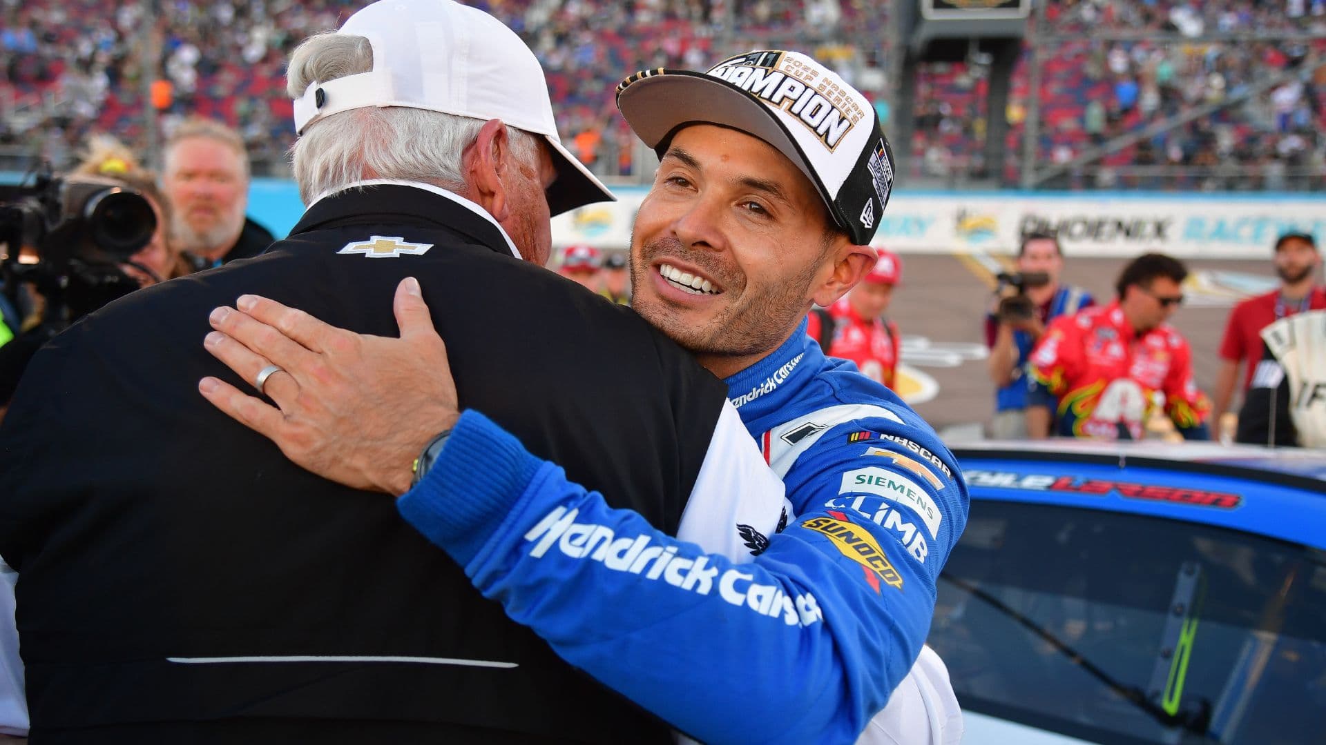 Nov 2, 2025; Avondale, Arizona, USA; NASCAR Cup Series driver Kyle Larson (5) celebrates his championship victory with team owner Rick Hendrick following the Cup Series Championship race at Phoenix Raceway.