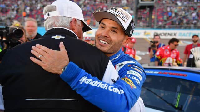 Nov 2, 2025; Avondale, Arizona, USA; NASCAR Cup Series driver Kyle Larson (5) celebrates his championship victory with team owner Rick Hendrick following the Cup Series Championship race at Phoenix Raceway.