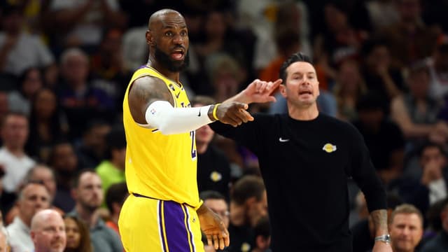 Los Angeles Lakers forward LeBron James (23) and head coach JJ Redick against the Phoenix Suns at Mortgage Matchup Center