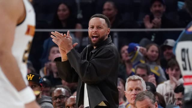 Feb 22, 2026; San Francisco, California, USA; Golden State Warriors guard Stephen Curry (30) cheers from the bench during a game against the Denver Nuggets in the third quarter at Chase Center. Mandatory Credit: David Gonzales-Imagn Images