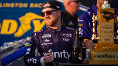 Mar 22, 2026; Darlington, South Carolina, USA; 23XI Racing Tyler Reddick (45) celebrates in Victory Lane after winning at Darlington Raceway