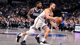 Golden State Warriors guard Stephen Curry (30) and Dallas Mavericks guard Kyrie Irving (11) in action during the game between the Dallas Mavericks and the Golden State Warriors at the American Airlines Center.
