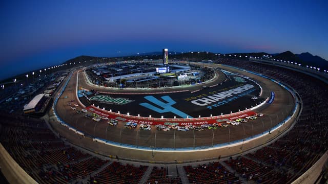 Nov 1, 2025; Avondale, Arizona, USA; NASCAR Xfinity Series driver Justin Allgaier (7) and driver Jesse Love (2) lead the restart during the Xfinity Series Championship race at Phoenix Raceway.