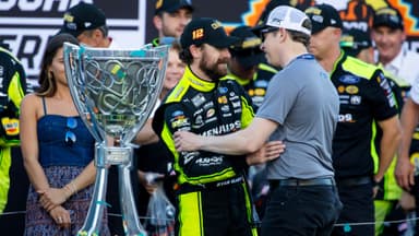 Nov 5, 2023; Avondale, Arizona, USA; NASCAR Cup Series driver Ryan Blaney (left) is congratulated by Brad Keselowski as he celebrates after winning the 2023 NASCAR Cup Series Championship at Phoenix Raceway