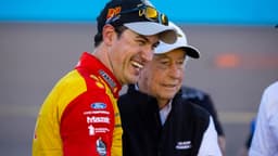 Nov 6, 2022; Avondale, Arizona, USA; NASCAR Cup Series driver Joey Logano celebrates with team owner Roger Penske after winning the Cup Championship at Phoenix Raceway