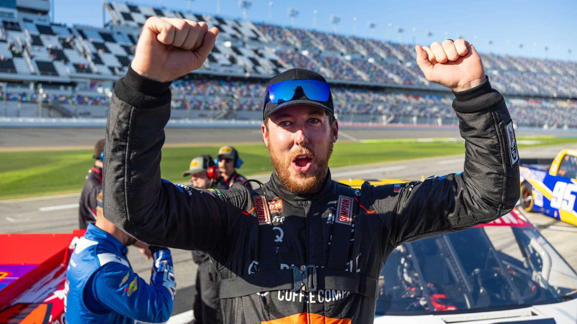 Feb 13, 2026; Daytona Beach, Florida, USA; NASCAR Truck Series driver Garrett Mitchell celebrates during qualifying for the Fresh from Florida 250 at Daytona International Speedway