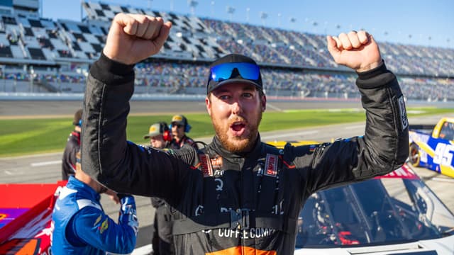 Feb 13, 2026; Daytona Beach, Florida, USA; NASCAR Truck Series driver Garrett Mitchell celebrates during qualifying for the Fresh from Florida 250 at Daytona International Speedway