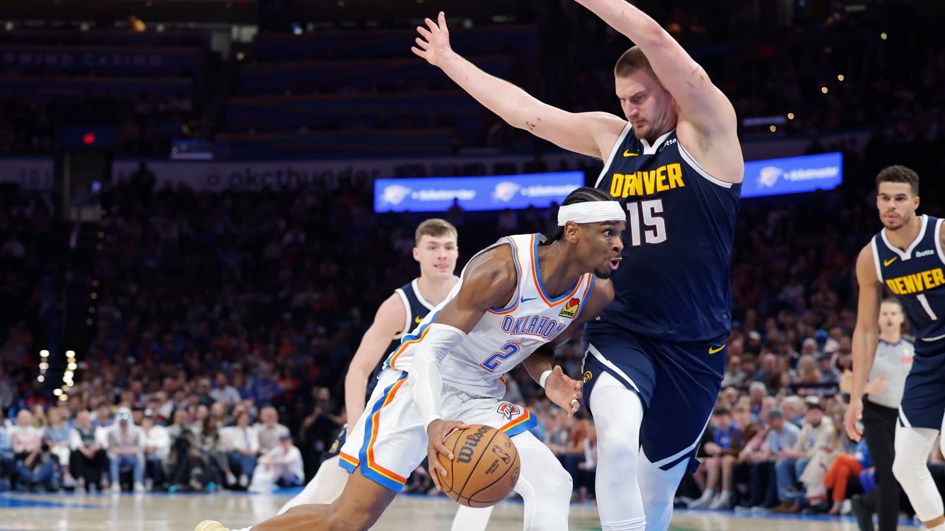 Mar 10, 2025; Oklahoma City, Oklahoma, USA; Oklahoma City Thunder guard Shai Gilgeous-Alexander (2) drives against Denver Nuggets center Nikola Jokic (15) during the second half at Paycom Center.
