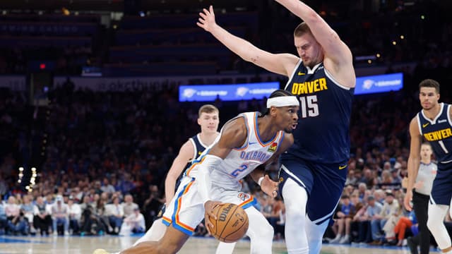 Mar 10, 2025; Oklahoma City, Oklahoma, USA; Oklahoma City Thunder guard Shai Gilgeous-Alexander (2) drives against Denver Nuggets center Nikola Jokic (15) during the second half at Paycom Center.