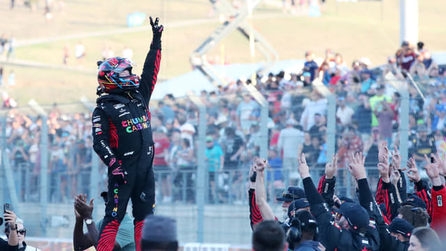 Mar 1, 2026; Austin, Texas, USA; NASCAR Cup Series driver Tyler Reddick (45) raises three fingers after his third win in a row at the NASCAR Cup Series Duramax Texas Grand Prix Powered by RelaDyne at Circuit of the Americas. Mandatory Credit: Michael C. Johnson-Imagn Images
